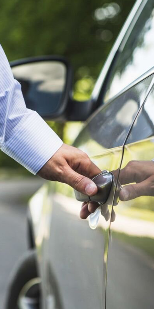 Professional unlocking car door during lockout