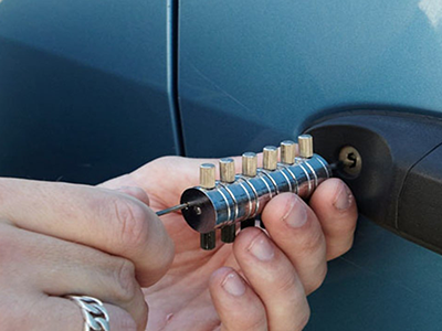 Professional locksmith assisting with car lockout